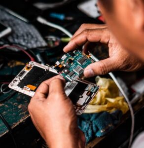 man repairing Android smartphone
